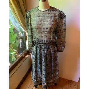 Vintage black dress with gold metallic detail